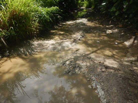 Degraded conditions of the roadway during the wet season 